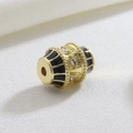 Macro shot of gold barrel bead with black enamel and marquise cubic zirconia stones - Black White Stone Drum (06)