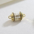 Macro detail of gold cylinder charm with white enamel, star patterns and colorful crystals - White Multicolor Gem Connector (07)