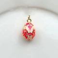Macro shot of a 18k gold-plated Russian egg pendant with red and pink enamel details - Red Baroque (11)