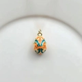 Detail of 18k gold plated egg pendant with orange and peacock blue enamel patterns - Orange Blue (13)
