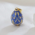 Detailed macro of a Faberge-style blue enamel egg pendant with gold scrollwork and crystals - Dark Blue (02)