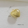 Macro detail of 18k gold irregular heart pendant with hammered texture and 1.5cm size - Hammered Heart Style (01)