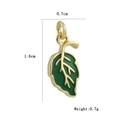 Macro detail of leaf-shaped green enamel charm with 18k gold plating and dimension marks - Green Leaf Style