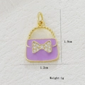 Detail view of purple enamel handbag pendant with crystal bow, size 1.9cm by 1.2cm - Purple Handbag (05)