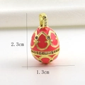 Detailed view of Faberge style 2.3x1.3cm egg pendant with pink enamel and gold filigree - Coral Pink Hollow Pattern Style (01)