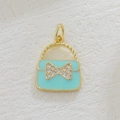 Macro detail of 18k gold plated blue enamel handbag charm with zircon bow - Blue Handbag (06)