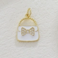 Detail of 18k gold-plated handbag pendant with white enamel and rhinestone bow - White Handbag (09)