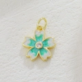 Golden cherry blossom pendant with white glitter petals, green enamel, and zircon center - White And Green Sakura Style (02)