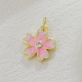 Detailed view of pink cherry blossom pendant with golden edges and zircon center - Pink White Gradient Sakura Style (04)