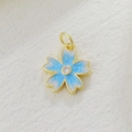 Macro shot of cherry blossom pendant with blue enamel and sparkling cubic zirconia - Blue White Gradient Sakura Style (05)