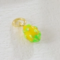 Macro shot of yellow dragon fruit pendant with gold loop for DIY jewelry making - Yellow Dragon Fruit
