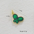 Macro detail of a 1.2cm green butterfly pendant with 18k gold plating and enamel finish - Butterfly Green Enamel (31)