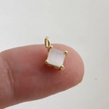 Detailed view of a square-cut zircon pendant featuring a 18k gold-plated 4-prong setting - White Square Cat's Eye Stone Pendant