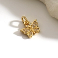 Macro detail of gold plated butterfly pendant with micro-paved white cubic zirconia stones - Mini Butterfly Style