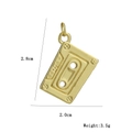 Detailed close-up of a vintage cassette tape pendant in 18k gold-plated copper finish - Retro Cassette Shape
