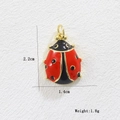 Detailed view of red enamel ladybug pendant with 18k gold plating showing size measurements - Large Red Black Ladybug (01)