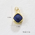 Macro shot of gold teardrop lapis lazuli pendant with precise dimensions 2.2x1.2cm - Teardrop Blue Stone (06)