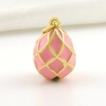 Detailed view of pink egg pendant with gold-plated lattice enamel pattern - Pink Gold Grid Pattern Style