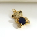 Macro view of teddy bear pendant with gold plating, black and white zircon, and blue stone - Blue Oval Belly Bear (05)