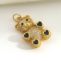 Macro view of teddy bear pendant featuring gold plating and inlaid white zircon stones - Blue Heart Paw Pave Bear (06)