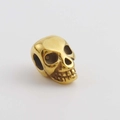 Dettaglio di un ciondolo a forma di teschio dorato con zirconia per gioielli fai-da-te - Teschio Oro Perforato Lucido (16)