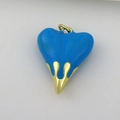 Detail of blue enamel heart pendant with golden liquid drip design and metallic loop - Sky Blue