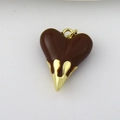 Detail of a solid heart pendant with chocolate brown enamel drip and gold plating finish - Dark Coffee