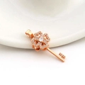 Close-up of a 18k rose gold key pendant with clover heart head and micro-set zircons - Key Style (05)