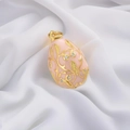 Detail of pink enamel Faberge-style egg pendant with gold filigree and sparkling crystals - Light Pink