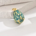 Blue enamel egg pendant with gold floral relief and white cubic zirconia accents - Green