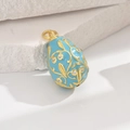 Sky blue enamel Fabergé style egg pendant with golden vine pattern and white crystals - Blue
