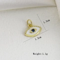 Detail of 1.3cm evil eye pendant with blue gemstone and white enamel in gold finish - White Evil Eye (A)