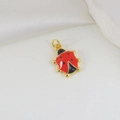 Macro shot of gold-plated ladybug charm with red enamel and black spots for jewelry making - Bright Red Ladybug (9)