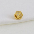 Macro shot of gold-plated hexagonal charm with micro-paved cubic zirconia for DIY jewelry - Dice Style C