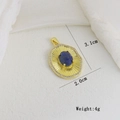 Macro detail of a 3.1cm vintage gold pendant with lapis lazuli and CZ border - Blue Stone Oval (C)