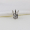 Detailed macro view of silver crown charm with micro-set black cubic zirconia for DIY jewelry - Crown Style C