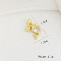 Gold dolphin charm with heart cubic zirconia, measuring 1.6cm height and 1.1g weight - Heart Zircon Dolphin (I)