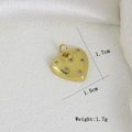 Detailed view of heart-shaped gold pendant with cubic zirconia inlay and 1.7cm height - Six Stone Micro-convex Heart Style (E)