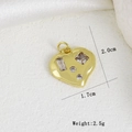 Macro shot of gold heart pendant with cubic zirconia inlay and size measurements - Irregular Four Stone Heart Style (I)