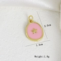 Detailed view of pink enamel star pendant with dimensions 2.0cm by 1.3cm and 1.8g weight - Pink Base Gold Star Oval Pendant (G)