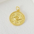 Detail of gold-plated evil eye pendant with sun star embossing and beaded edge - Round Evil Eye Style (01)