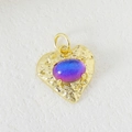 Gold hammered heart pendant with color-changing gemstone on white marble background - Hammered Heart Blue Purple Color Change Style (04)