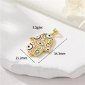Macro detail of 18k gold plated Hamsa hand pendant with blue evil eye enamel and crystals - Hollow Evil Eye Palm (40)