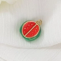 Macro shot of watermelon slice pendant with gold plating and red enamel details - Cut Watermelon (29)