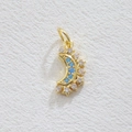 Macro detail of 18k gold plated moon and star pendant with blue zircon stones - Gold Moon Starburst (5867416729799)