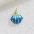 Macro shot of seashell pendant with blue enamel gradient and gold plating detail - Dark Blue Gradient Shell (08)