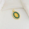 Macro detail of golden Virgin Mary oval pendant with green inlay and sparkling crystals - Dark Green Enamel Virgin Mary Oval Style (09)