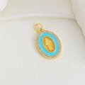 Close-up of golden religious oval pendant with blue enamel and saint relief - Light Blue Enamel Virgin Mary Oval Style (10)