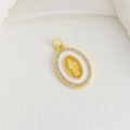Macro detail of gold Virgin Mary oval pendant with white enamel and zircon border - White Enamel Virgin Mary Oval Style (11)