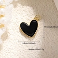 Detail view of black enamel heart pendant with dimensions 17.5mm by 15.8mm and weight - Black Enamel Heart (27)
